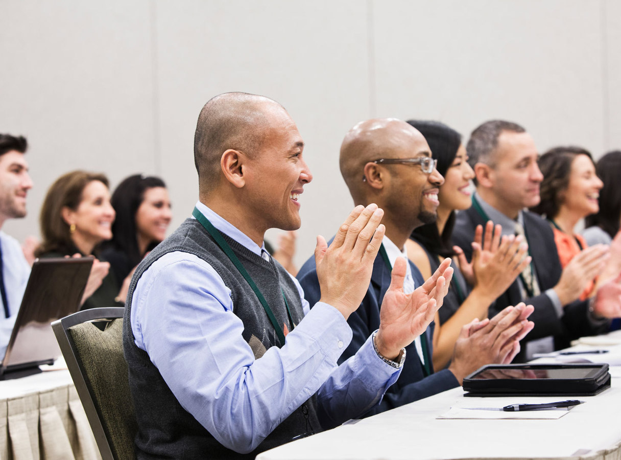 An audience at the conference applauding